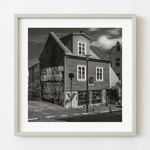 Graffiti covered wooden house in Reykjavik black and white