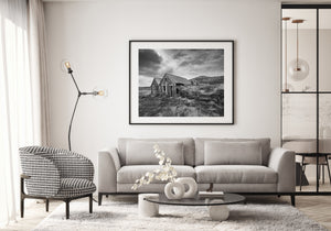 old Icelandic rural house with turf walls and dramatic clouds