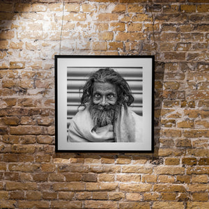 Candid street photograph of an elderly bearded man in India