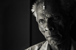 Close portrait of an elderly Indian man at his workplace
