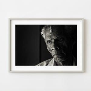 Toned monochrome portrait of an elderly man in Kochi India