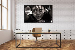 sepia toned portrait of Indian girl looking directly at camera