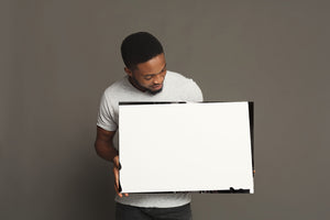 child portrait with hands raised casting shadows across face