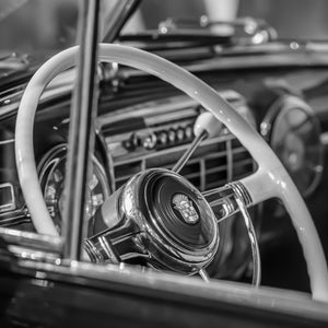 Vintage Cadillac interior with chrome and white details