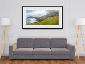 County Kerry coastline with rolling surf and hillside pastures