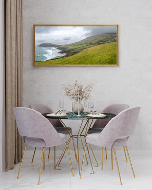 Green fields and stone walls above a rugged Irish shoreline