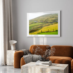 Countryside scene with rolling fields and Irish cottages