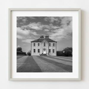 Black and white photograph of a rural manor house in Ireland