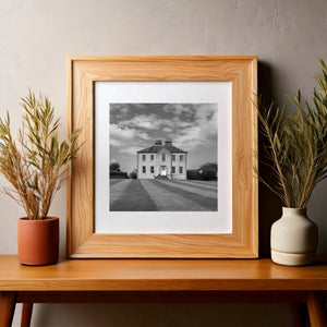 Irish manor facade with a white door and arched window