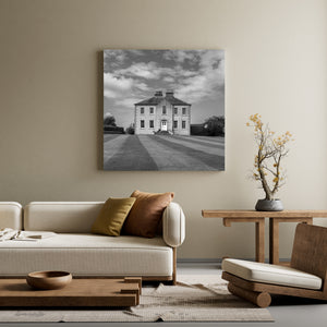 Traditional two-story Irish house under dramatic clouds