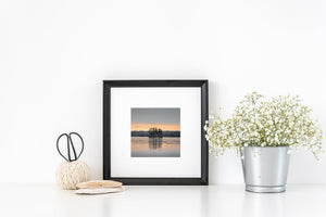 Orange horizon over Maine island