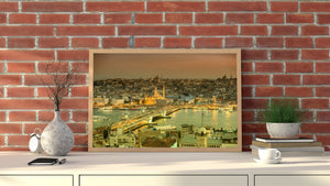 Istanbul skyline and waterfront traffic beneath a warm evening sky, viewed across Galata Bridge.