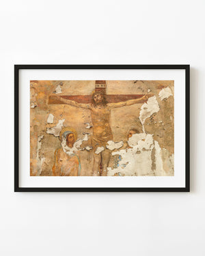 Weathered Italian crucifixion fresco in warm ochre tones