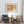 Cracked wall painting with a cross and ochre background