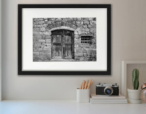 Weathered wooden door with stone wall fine art