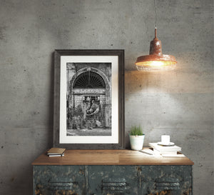 Urban street art figure painted on shop shutter in Italy