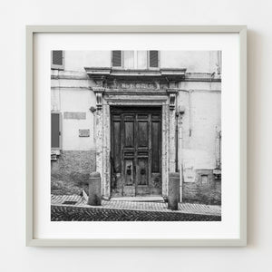 weathered wooden door in Italy black and white