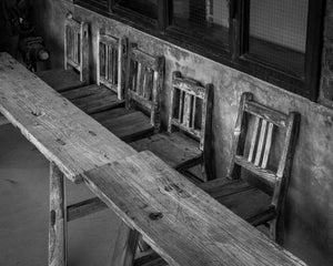 Traditional Japanese interior with aged wooden table and chairs