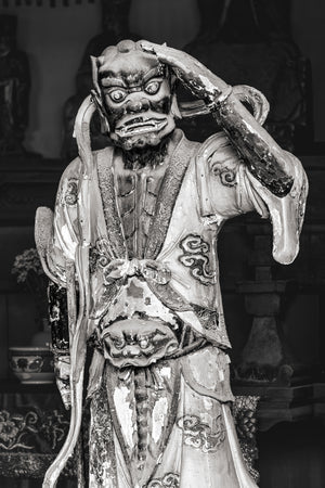 Weathered Senrigan figure displayed in the Mazu Hall