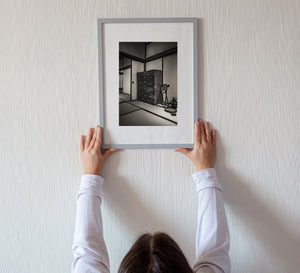 Minimalist Japanese interior architecture with tatami mats and wooden cabinet