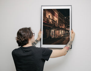 Japanese storefronts at night warm tones city scene
