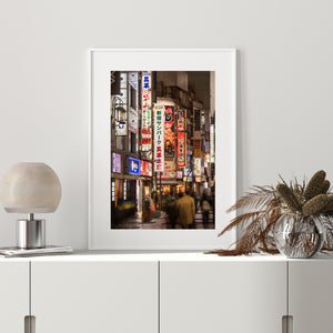 Urban Tokyo night scene with colorful signage and motion blur