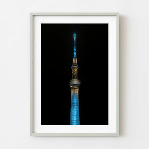 Tokyo Skytree illuminated blue and gold at night