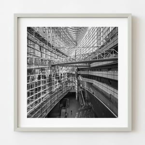 Tokyo International Forum glass atrium with suspended steel bridge black and white