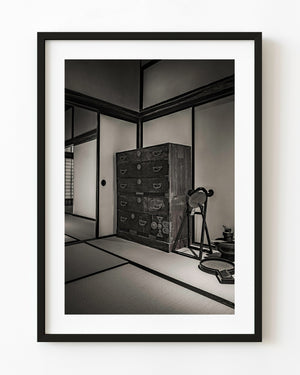 Traditional Japanese tatami room interior with antique tansu chest monochrome