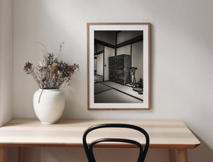 Traditional household objects beside antique chest in Japanese historic room