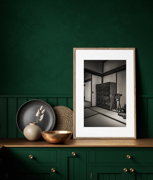 Historic Japanese tatami room with antique furniture and iron cookware