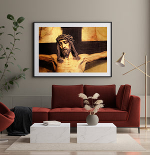 Crucifix sculpture with outstretched arms and golden tones