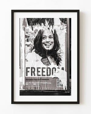 Torn political poster with freedom text Chicago street wall monochrome