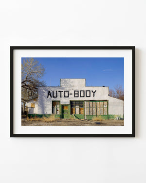 Weathered auto body shop in Keeler California beneath a blue sky