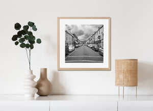 Cloudy sky above a busy Irish town street in Kenmare