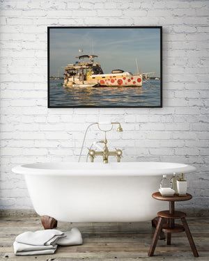 Improvised houseboat deck above a hull decorated with red circles