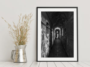 Kilmainham Gaol interior with arched ceiling and shadowed cell doors