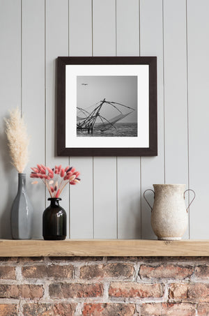 Sweeping net mesh and timber supports above the sea at dusk
