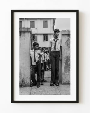 Schoolboys outside a school in Kochi India black and white
