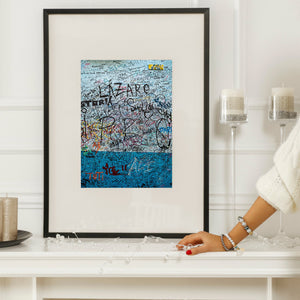 Vertical Havana wall photograph with overlapping names and vivid blue paint.