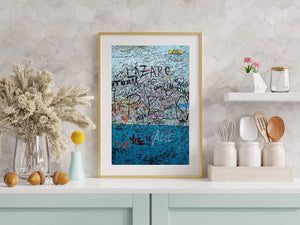 Weathered pale blue and turquoise plaster filled with visitor messages.