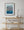 Vertical colour photograph of layered messages and bright blue paint at La Bodeguita.