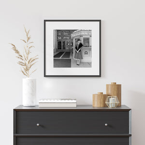 Lady standing by old theatre photo