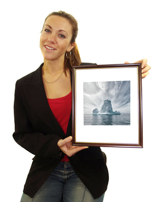 Fine art print of iceberg and clouds showcasing isolation and scale