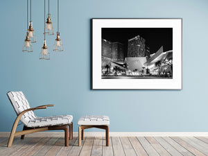 Black and white cityscape of illuminated Crystals and high-rise hotel buildings.