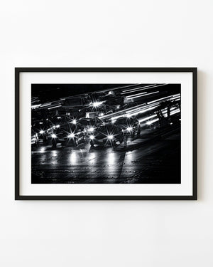 Black and white Las Vegas Strip traffic with starburst headlights