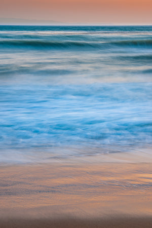 Long exposure ocean water with warm evening light