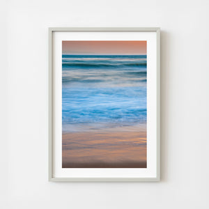 California coastal waves with soft motion at sunset