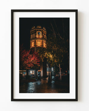 LeTAO Tower illuminated at night among autumn trees in Otaru, Japan.
