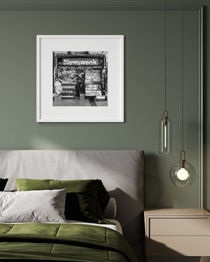 Candid moment of news seller reading a paper